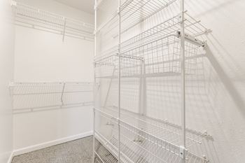 Empty white shelving unit in a room.